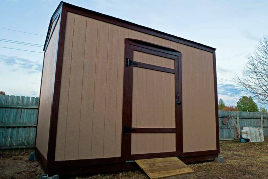 close-up-from-ground-of-customized-12x8-shed-builder's-construction-project-in-backyard-of-southaven-mississippi-homeowner-for-storage-by-1-handy-craftsman