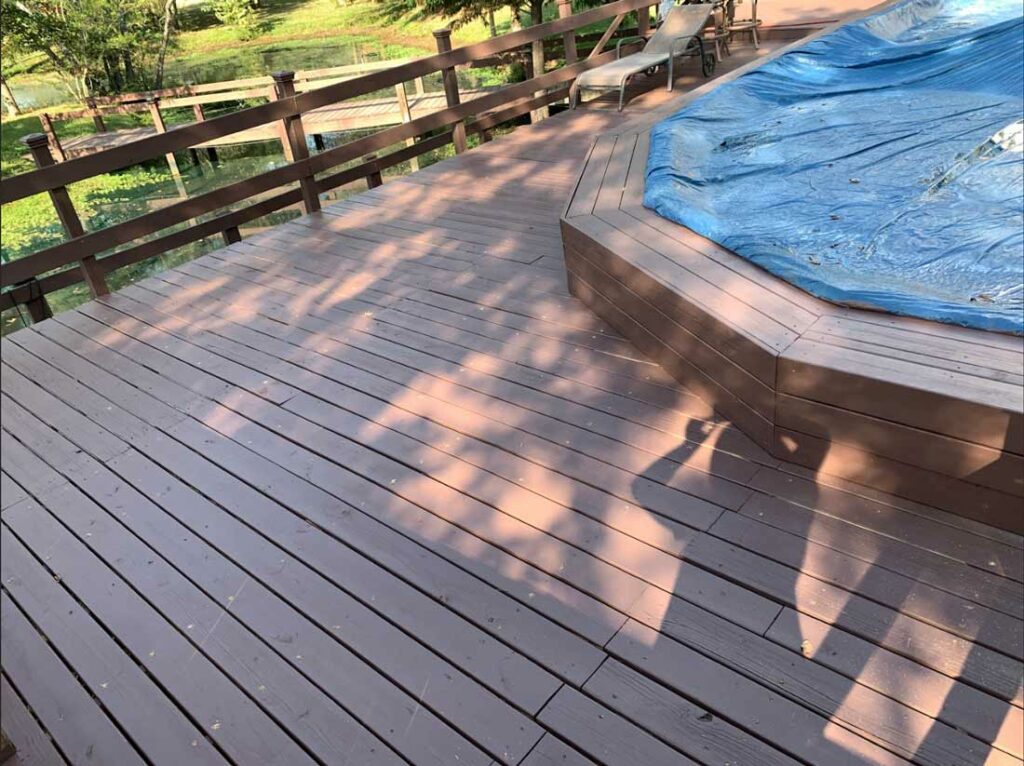 clean painted deck renovation services with stair construction next to lake in oakland, tennessee by 1 handy crafstman