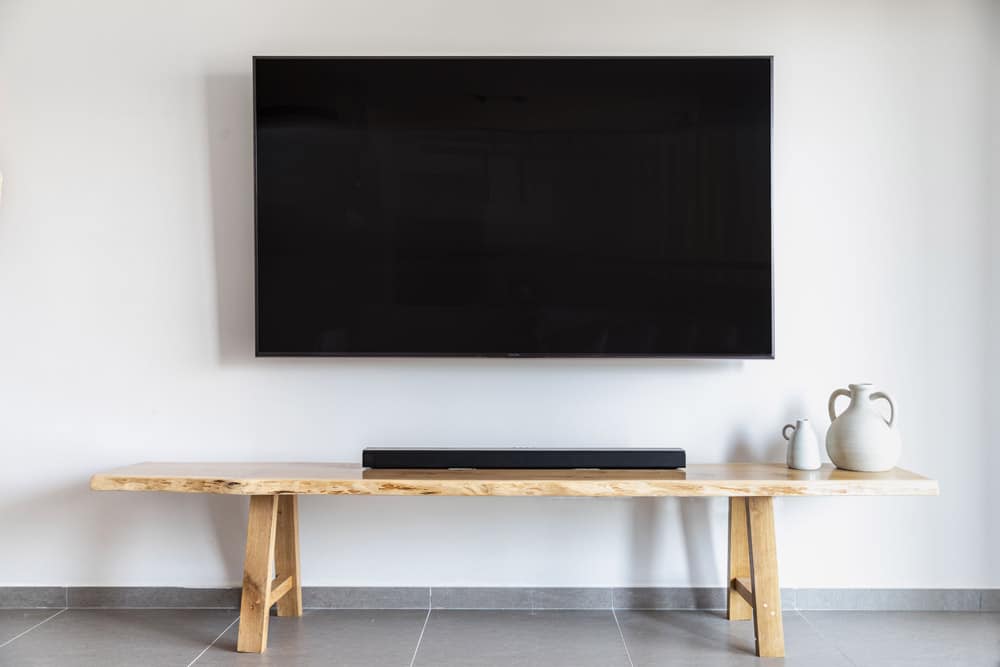 simple tv mounting service pro with woodwork coffee table in olive branch mississippi blank wall clean modern look.