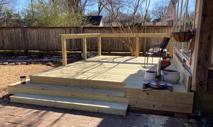 1 handy craftsman decks and railing portfolio picture of side step near entrance of home showing details of design with barrier in memphis tennessee