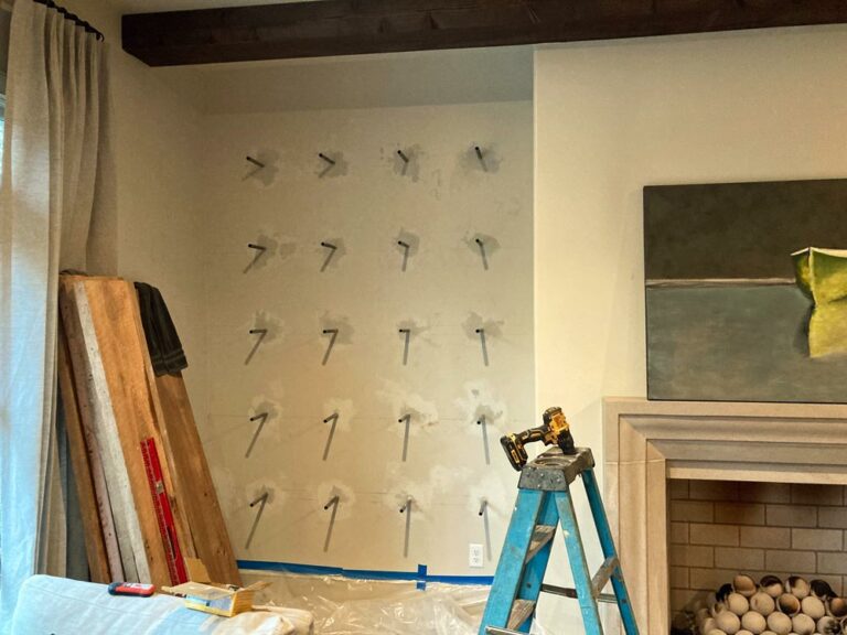 germantown tennessee home of interior designer drywall next to fireplace prepared with inserted wall bracket single peg mounts for large 6' floating shelves project by 1 Handy Craftsman in Germantown Tennessee 5 rows with 4 mounts perfectly squared carpentry made by hand jordan trask