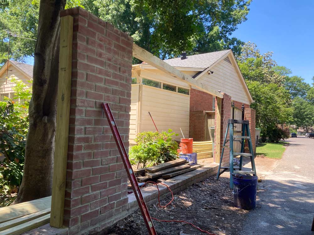 framing up a wooden fence on brick veneers for privacy wall by 1 Handy Craftsman near germantown tennessee.