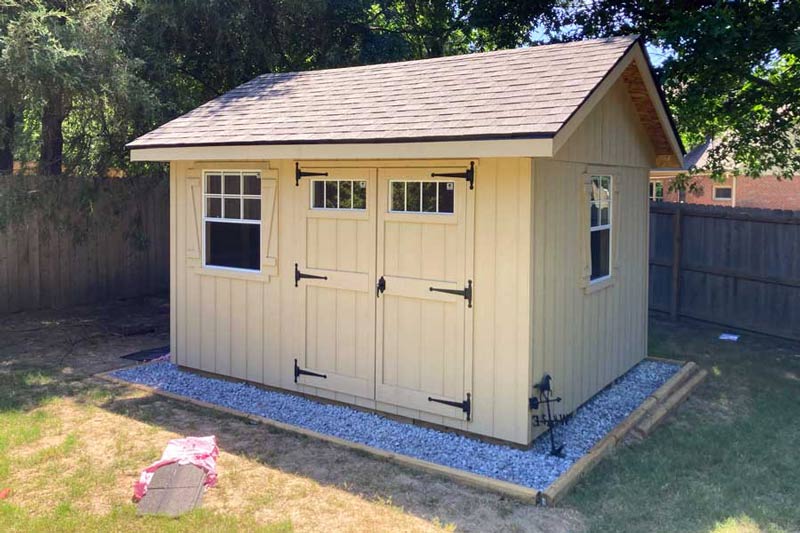 front look at newly constructed shed with smart siding and shingles that match house two windows facing entire yard from back corner by 1 Handy Craftsman near Memphis Tennessee.