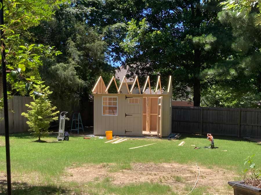 Shed rooting rafters up and soffit board in place for this 10x12 foot shed construction project by 1 Handy Craftsman near Memphis Tennessee.