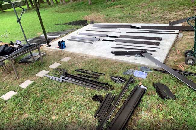 concrete slab in backyard where service professional is preparing to build gazebo bought at lowes near Memphis Tennessee.